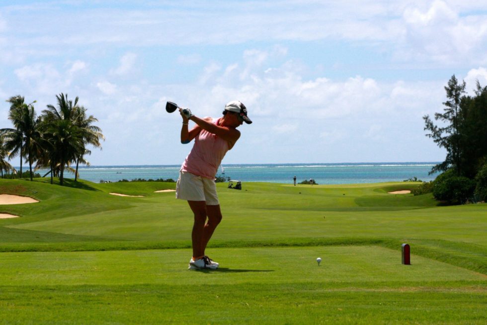 A woman playing golf
